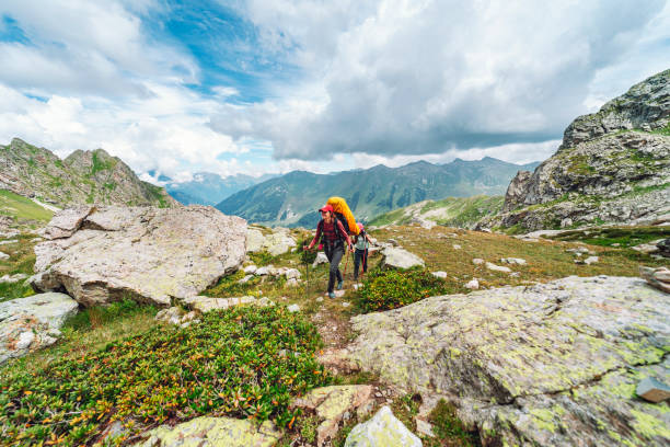 istock Mother with daughter trekking in mountains 1479646383