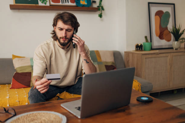istock Male bank client notices a problem and is worried about a credit card problem, the threat of financial fraud 1479648475