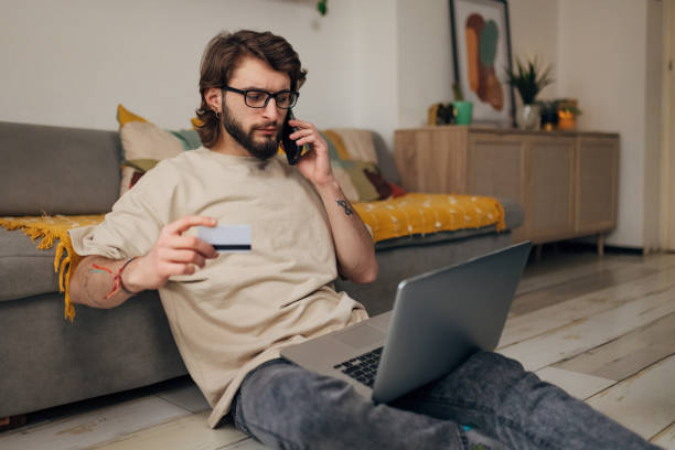 istock A man is on the phone, calling the bank to solve a problem with his credit card 1479648737