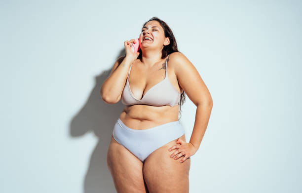 istock Plus size woman posing in studio in lingerie 1479649031