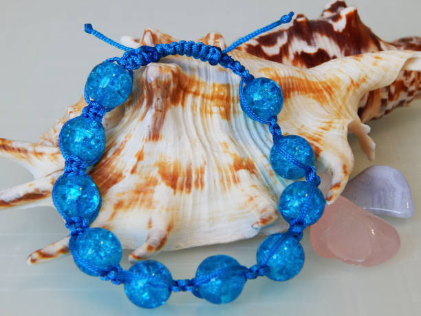 istock Blue bracelet and sea pebble 1479652866