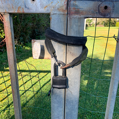 A padlock is an object that locks a door or loops a chain. It consists of a box in which there is a lock mechanism and a metal ring that can be opened or closed. The mechanism is controlled either by a key or by a system of numbered wheels