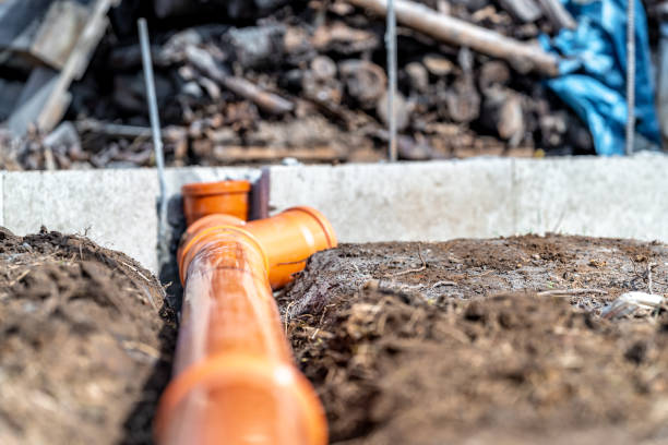 istock orange PVC plastic pipes on the construction site 1479657418