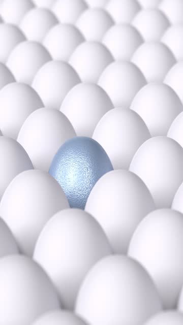 Vertical Blue Egg is Surrounded by Bunch of White Eggs in 4K Resolution