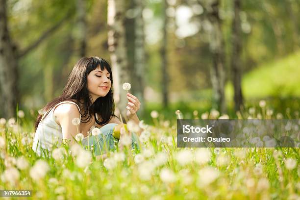Cute Woman In The Park With Dandelions Stock Photo - Download Image Now - Adult, Adults Only, Beautiful People