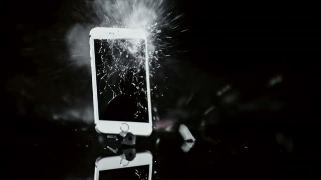 SLO MO LD Smartphone exploding into pieces