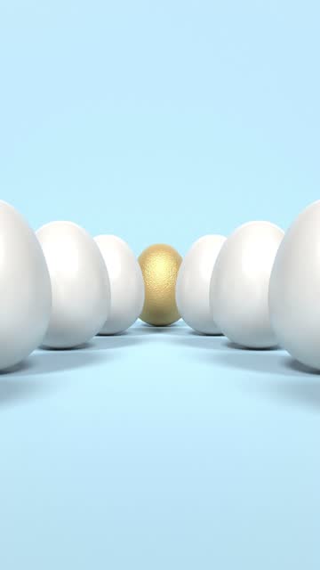 Vertical Golden Egg is Standing Out From White Eggs on Blue Background in 4K Resolution