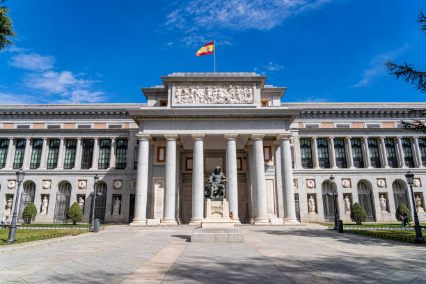 Panoramic view of the main facade of the Prado museum in the center of Madrid. 23 March 2023. Madrid, Spain. Panoramic view of the main facade of the Prado museum in the center of Madrid with the statue of Velazquez in front. the flag of the madrid spain stock pictures, royalty-free photos & images