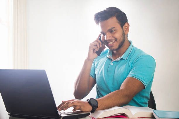 istock a young teenager talking on the phone while attending a class online 1479665932