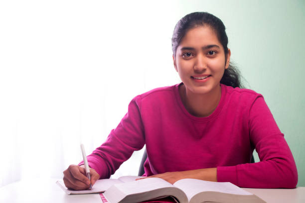 istock young teenager girl writing a notebook 1479666050