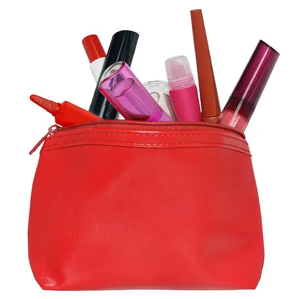 Red bag for cosmetics with a make-up accessories.