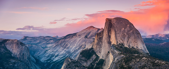 The landmark Half Dome as seen from Olmsted Point in Yosemite National Park California USA at sunset