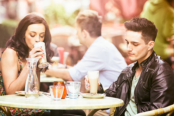 A happy woman enjoying a conversation at an outdoor cafe, capturing a moment of joy and connection during a casual meet-up. 5th Ave, Manhattan, NYC