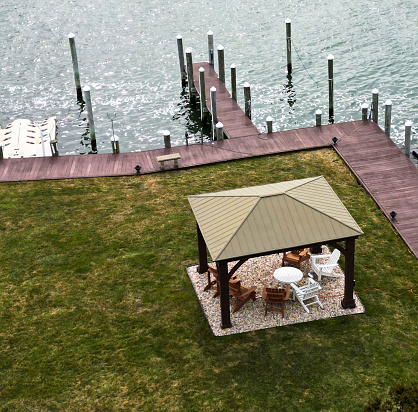 Overhead view of a small gazebo in a residential backyard on long island on the bay and a canal.