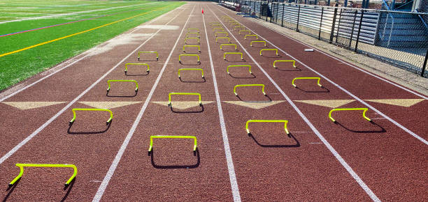 istock Four rows of mini hurdles set up on a track in lanes 1479682681