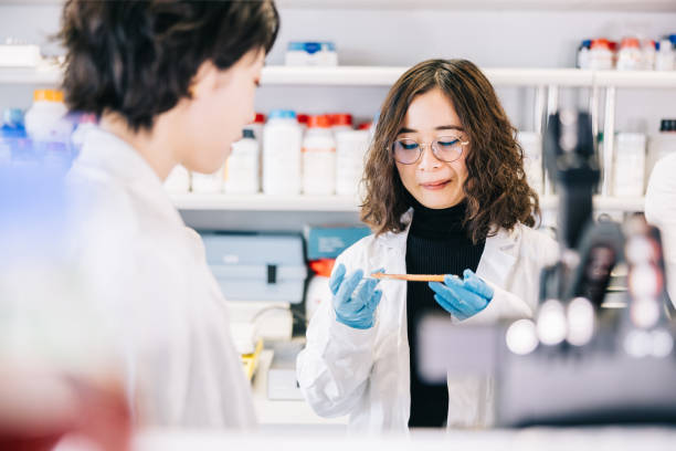 istock Japanese scientists working together on common goal 1479686875