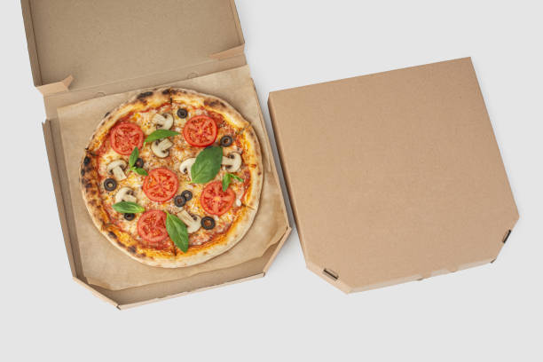 istock Pizza margherita with tomatoes and mushrooms on a white isolated background 1479687837