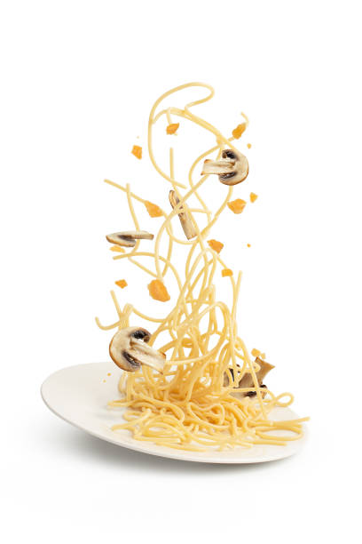 istock Pasta with mushrooms and cheese on a white background, levitation, ingredients falling into a plate. 1479688452