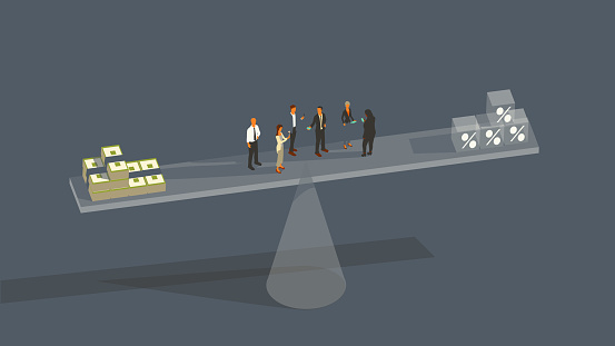 Six people stand suspended on a glass plank balanced precariously on the tip of a glass cone, with oversized bundles of cash and cubes with percent signs counterbalancing each other. The illustration communicates the balancing act of the Federal Reserve or similar central banks, who must determine how to balance economic stimulus with interest rates. Illustration presented in a flat color palette over a gray background, within a 16x9 art board.