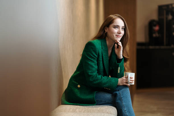 istock Female financial advisor sitting with mug 1479689346