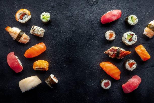 istock Sushi frame, a flat lay, top shot. Rolls, maki, nigiri on a black background 1479691727
