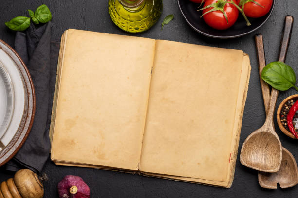 istock Top-down view of a kitchen table with ingredients, utensils, and an open cookbook 1479691878