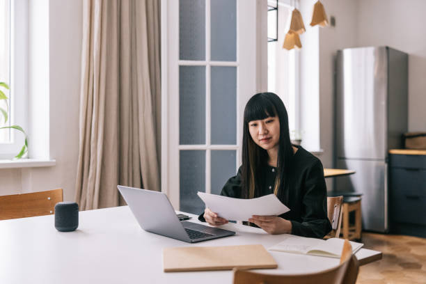 istock Woman updates her financial plan, ensuring her future stability. 1479692544