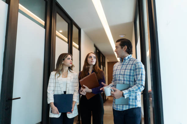 istock Three financial advisers standing and talking together 1479692546