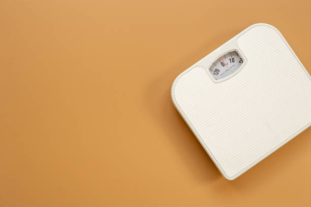 istock Check your body shape with white weight scales, top view 1479693684