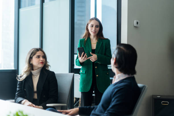 istock Financial advisor holding phone and talking to couple 1479693716