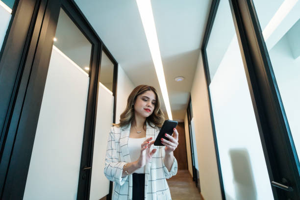 istock Young businesswoman standing in hallway 1479694444