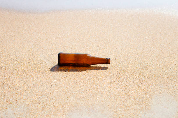 istock Glass bottle on the beach 1479694900