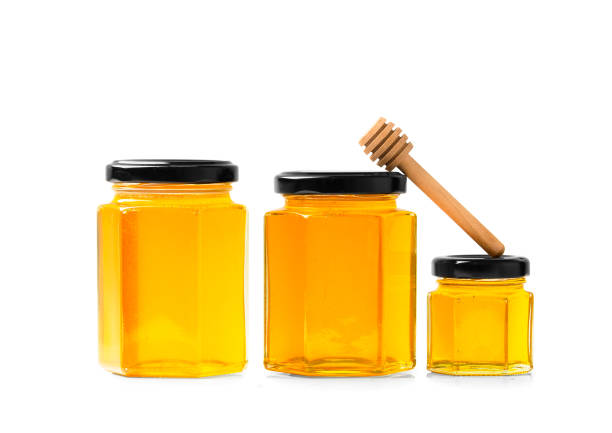 istock Honey in jars on a white background close-up. 1479696817