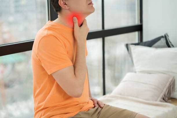 sore throat and cough, man with pain in neck at home - surprise color image gasping the human body imagens e fotografias de stock