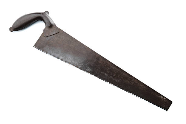 istock Saw for wood. Tools over wood panel. Collection of ancient instruments. 1479701113
