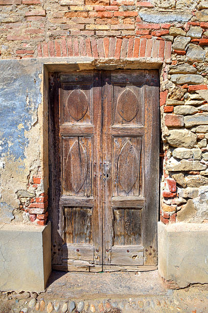 istock Old wooden door. Serralunga D'Alba, Italy. 147970949