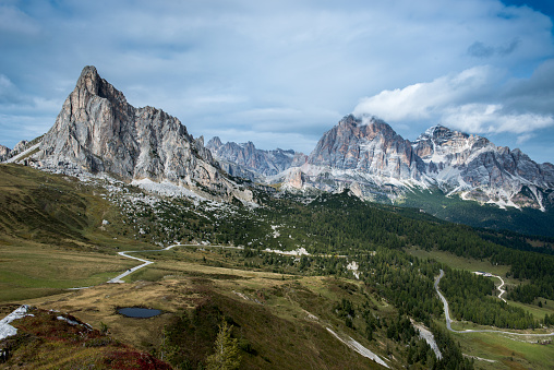 Sunny picturesque autumn alpine Dolomites rocky  mountain view from hiking path from Giau Pass to Cinque Torri (Five pillars or towers) rock famous formation, Sudtirol, Italy.