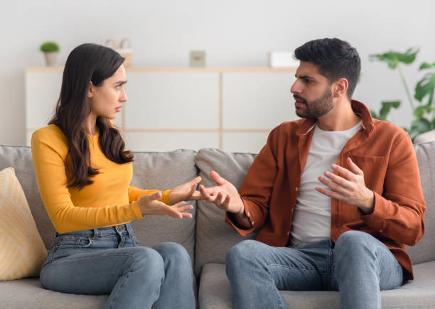 istock Angry Arabic Spouses Having Quarrel Arguing Sitting On Couch Indoor 1479721235