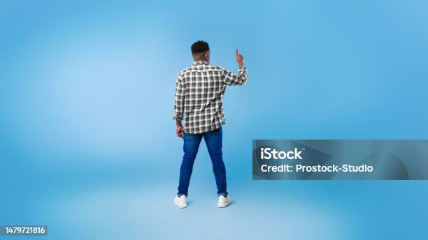 Pushing Back View Back View Of Young Black Guy Pushing Button On Virtual Screen Over Blue ...
