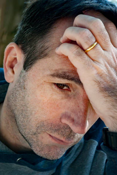 istock Worried man thinking with his hand on his forehead 1479722241