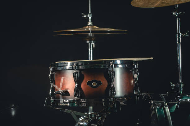 istock Drums on a black background close-up, percussion instrument on stage. 1479723288