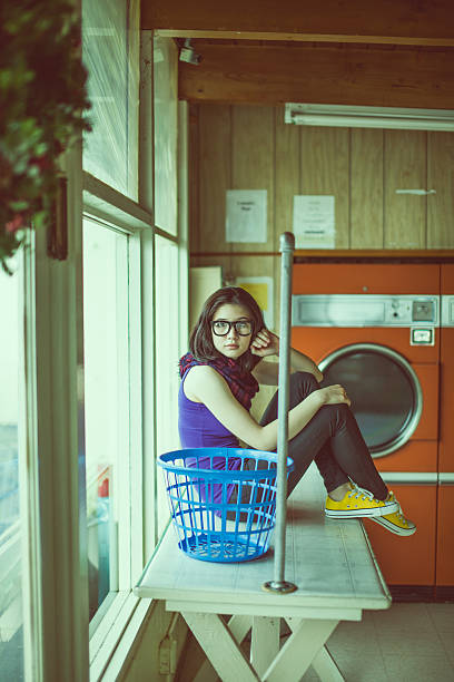 Washing machines, tumble dryer in a laundromat. industrial laundry equipment, energy efficient appliances, commercial laundry solutions, sustainable washing technology, hygienic washing environment