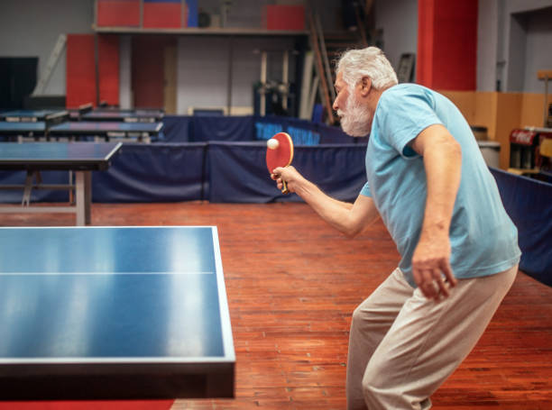 istock senior man plays table tennis in tehe hall 1479729154