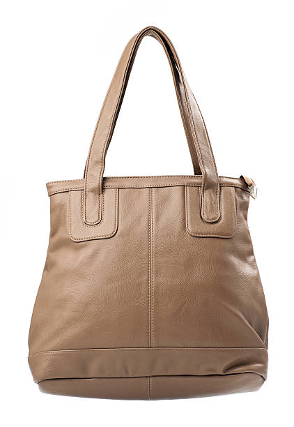 istock Beige female bag over white 147973036