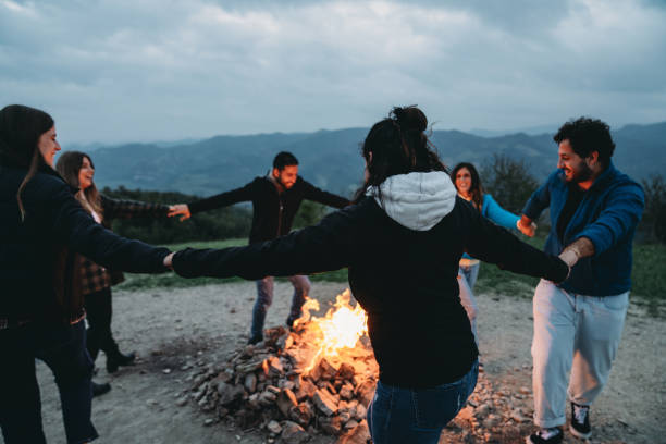 istock Friends are dancing in circle around a bonfire on the mountain 1479735122