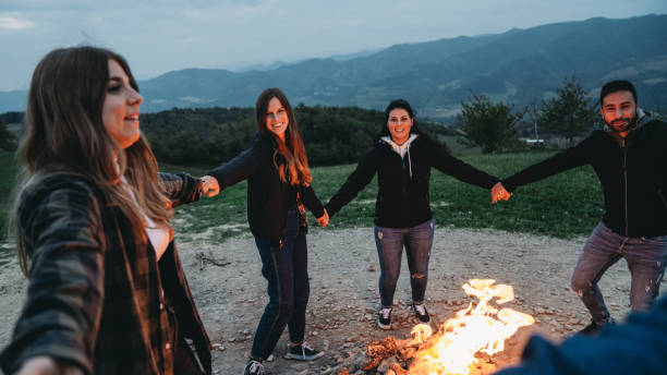 istock Friends are dancing in circle around a bonfire on the mountain 1479735187