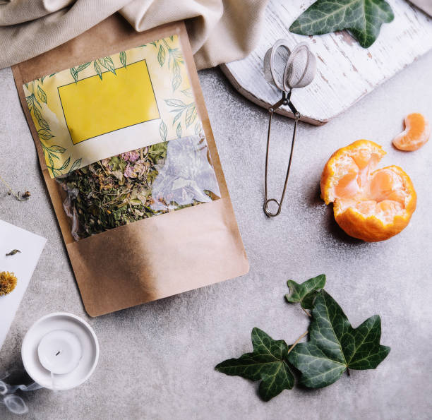 istock cup of tea with tangerines and tea packaging 1479735345