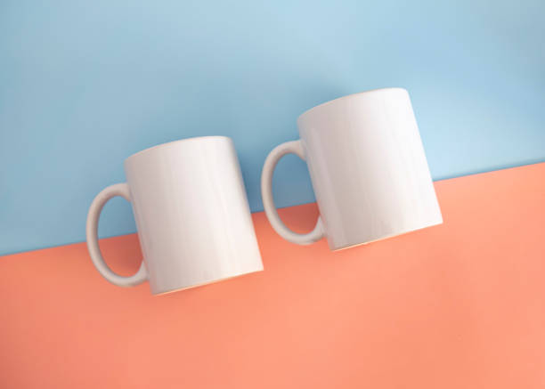 istock White mug on a blue and pink background. Minimalism. 1479736489