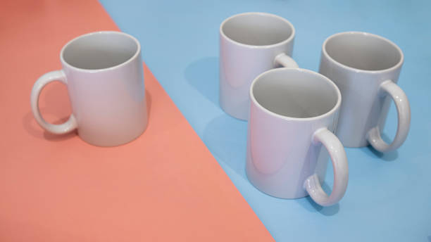 istock White mug on a blue and pink background. Minimalism. 1479736501