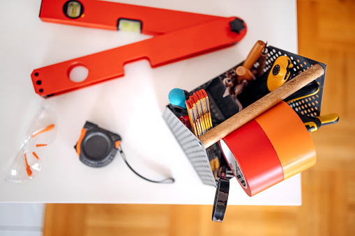 Construction tools with focus on yellow and red colour
